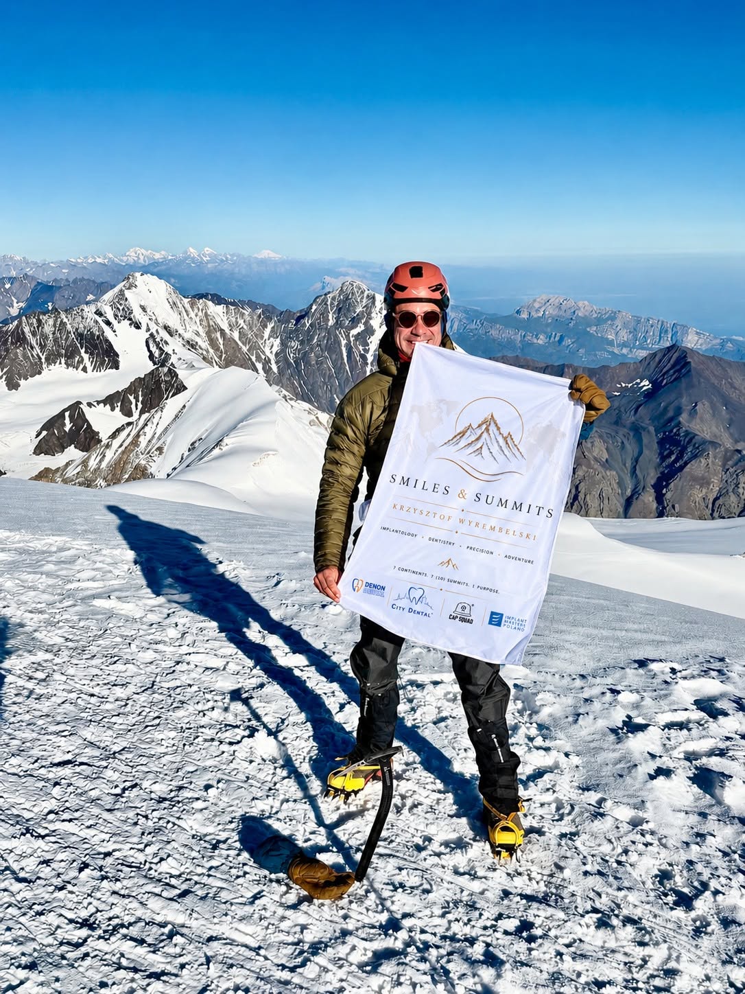 On the summit of Kazbek with the Smiles & Summits flag